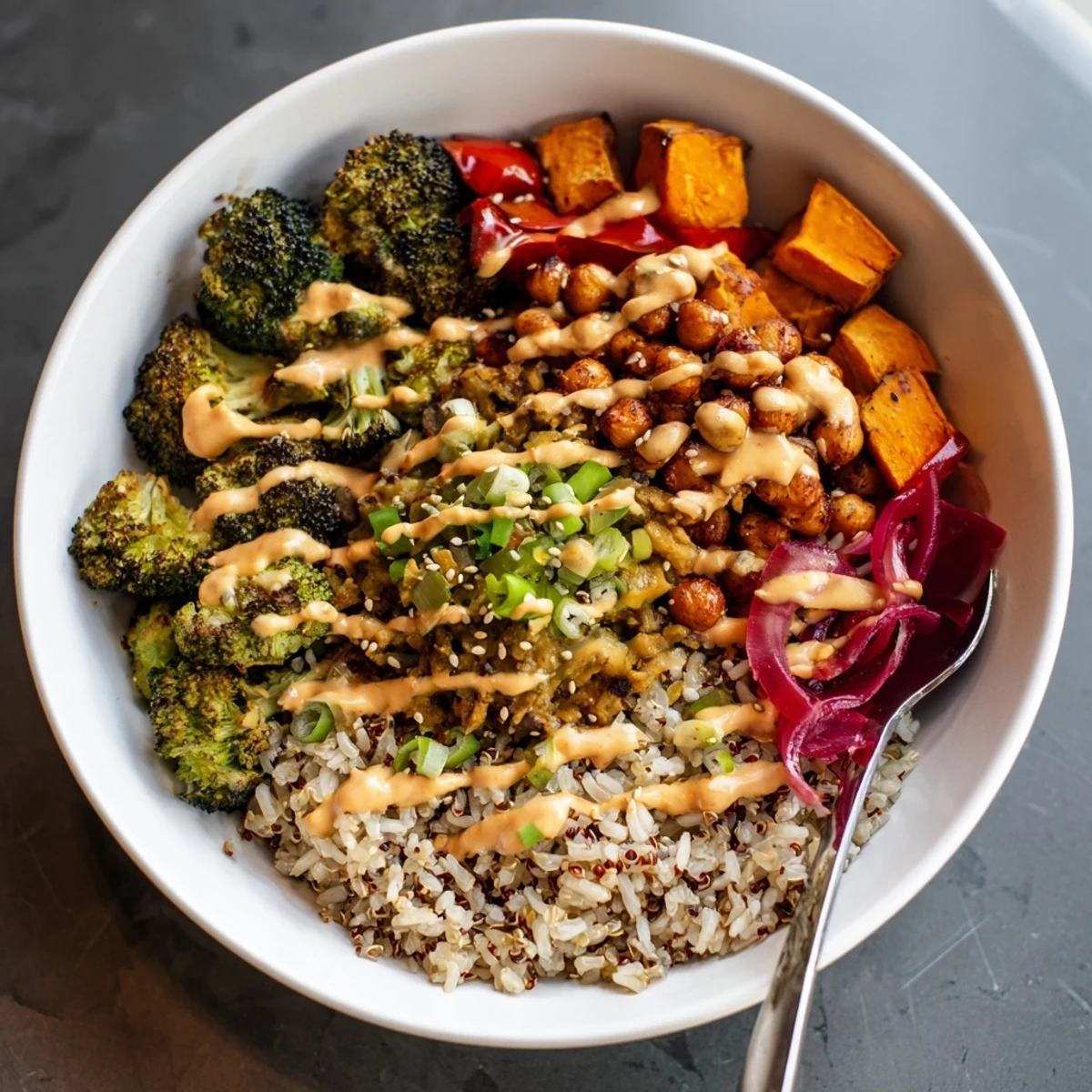 Colorful grain bowls featuring miso-butter and gochujang-maple sauces for a delightful meal.  