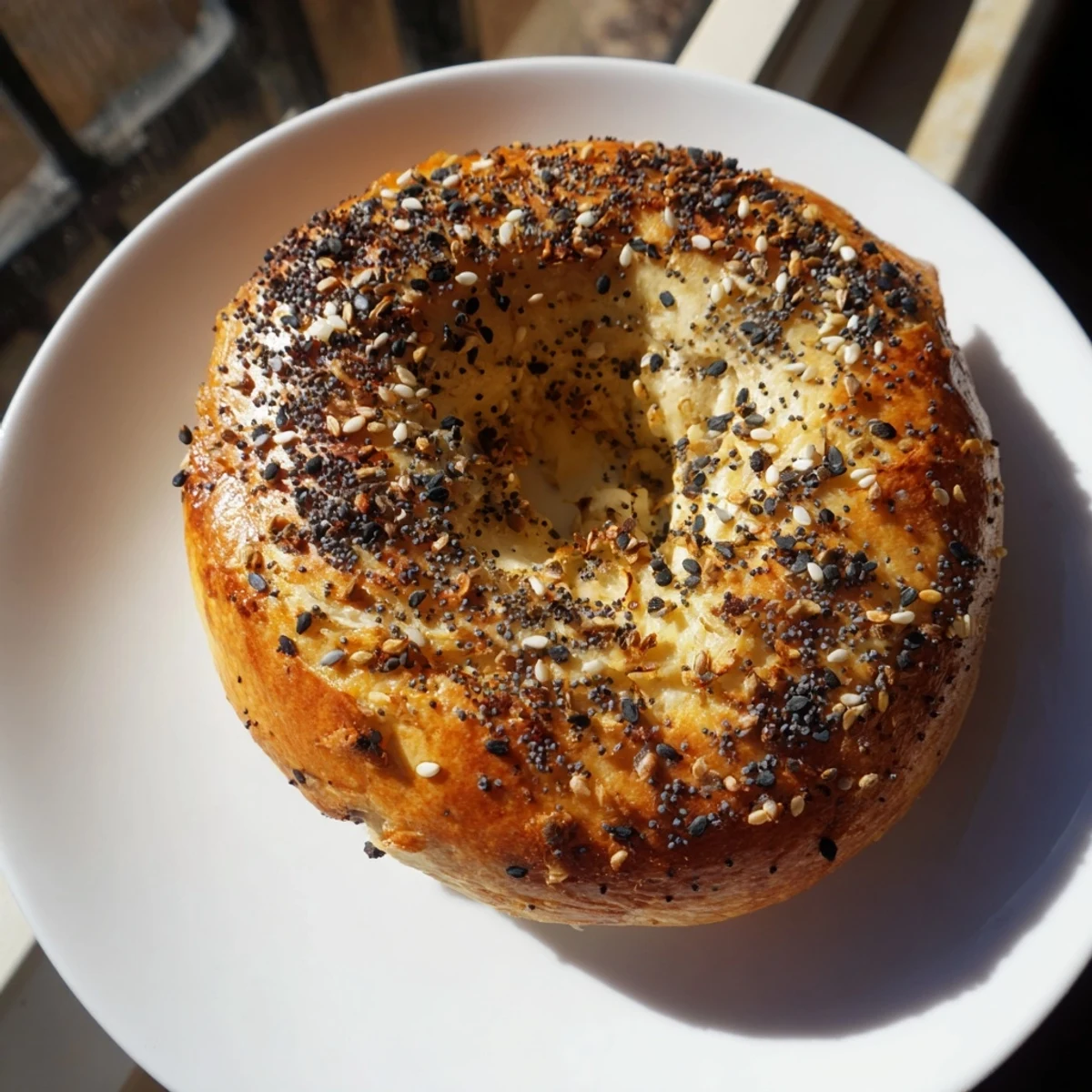 Golden brown Homemade Budget Bagels, fresh from the oven, offering a satisfying, chewy texture for breakfast.
