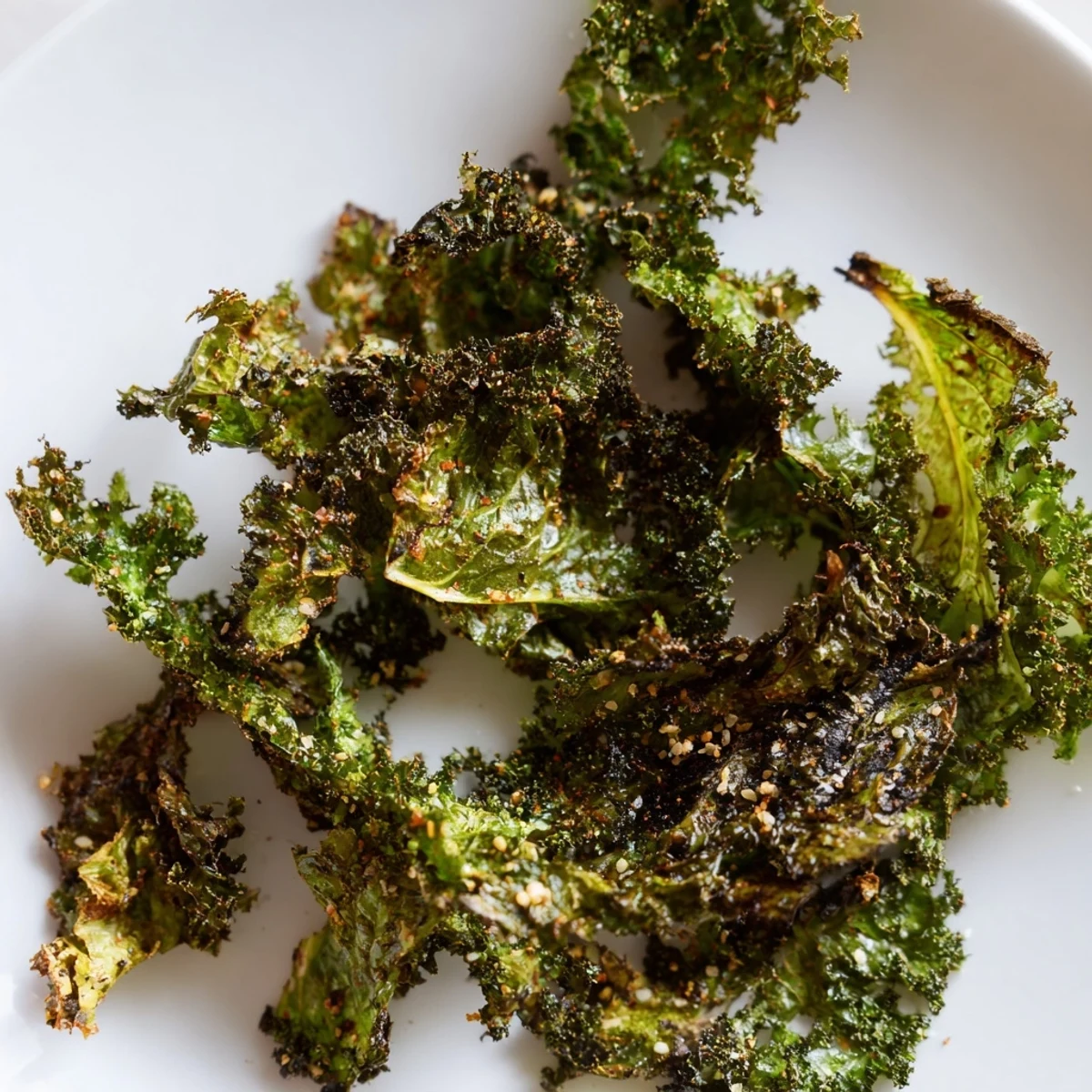 Oven-baked kale chips: imagine perfectly seasoned, crunchy pieces, ready for snack time.