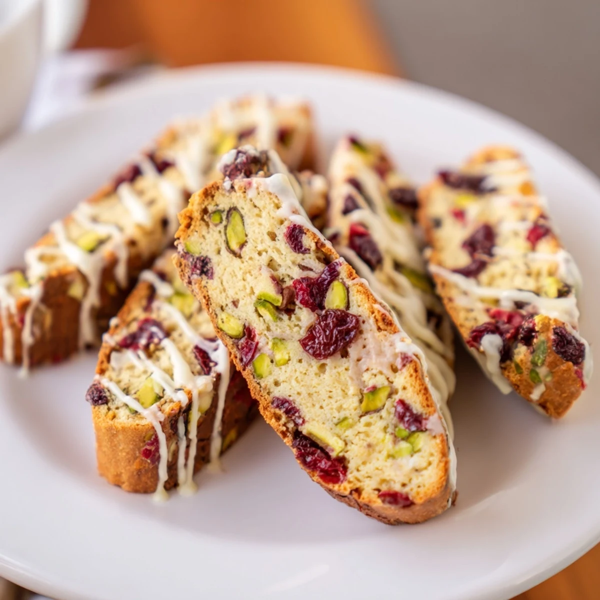 Golden-brown white chocolate cranberry pistachio biscotti, perfect for dunking into your morning coffee.
