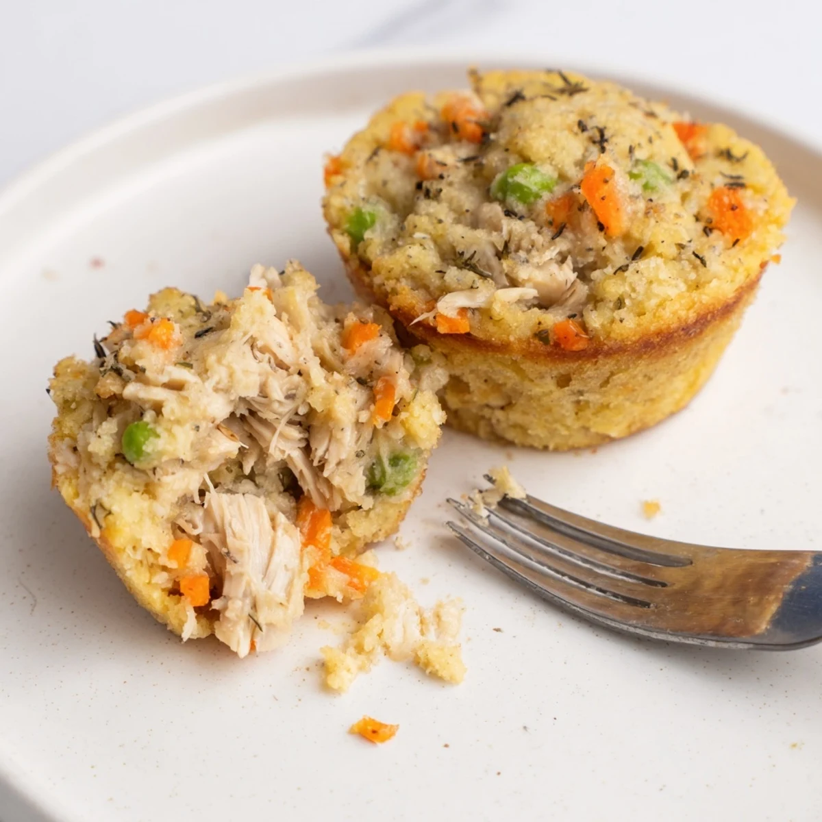 Golden-topped Chicken Pot Pie Cornbread Muffins, warm and savory, ready to be enjoyed as a snack.