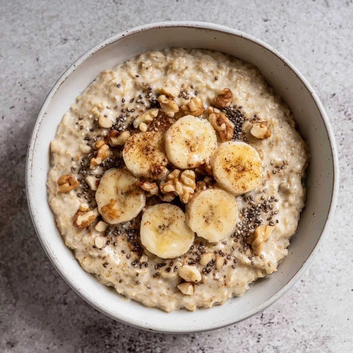 Steaming bowl of Microwave Banana Oats with sliced bananas, ready for a delicious breakfast.