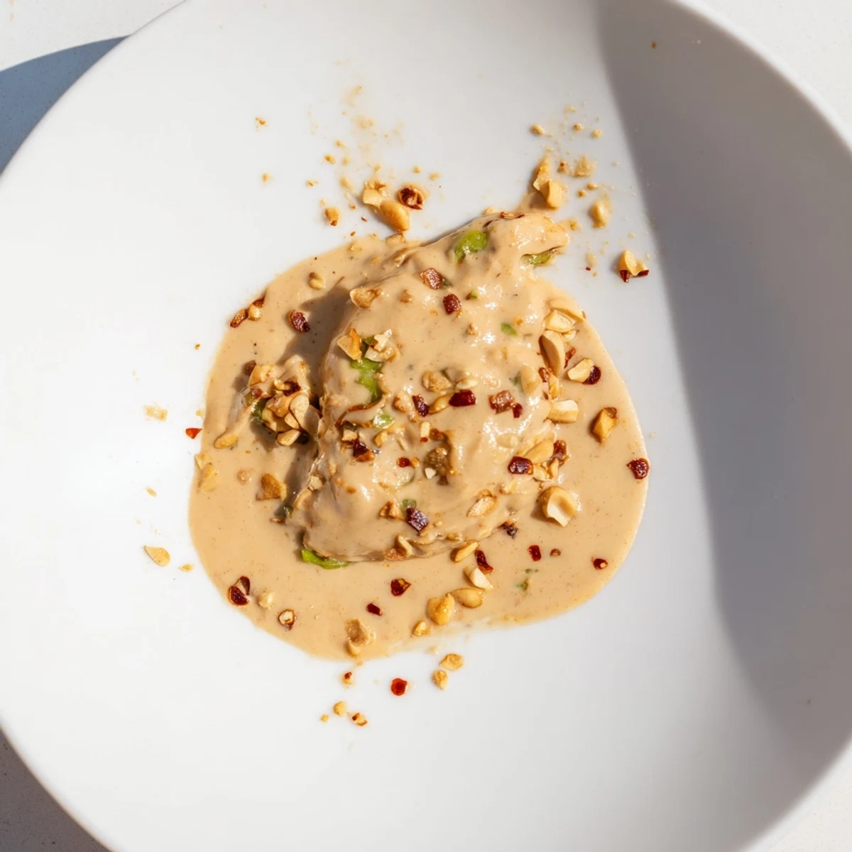 Close-up of Indonesian satay sauce: a creamy, richly spiced peanut sauce perfect for dipping.