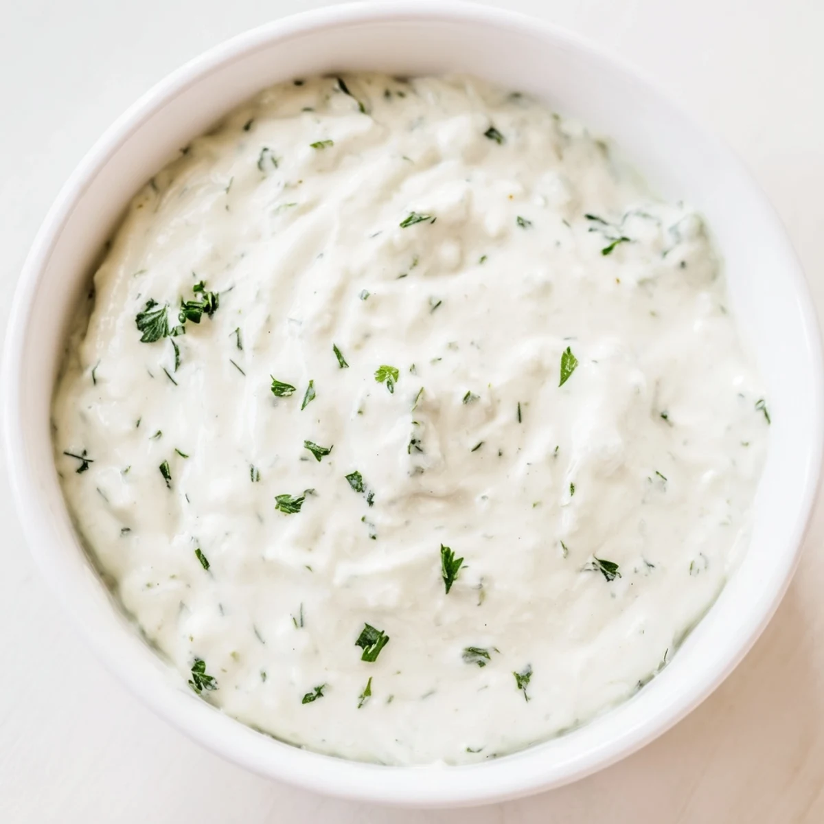 Close-up of fresh, flavorful Green Goddess Salad Dip, showcasing bright herbs and tangy taste.
