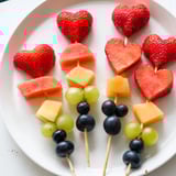 These beautiful Berry Good Heart Fruit Skewers feature bright red hearts of fruit, ready to eat and enjoy.