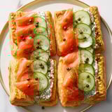 Elegant Étoiles Filantes arranged on a platter, showcasing layers of creamy cheese, salmon, and crispy stars.