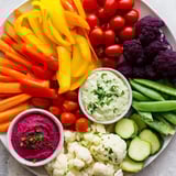 Vibrant Rainbow Vegetable Dips: a visually stunning arrangement of colorful vegetables alongside flavorful dips.