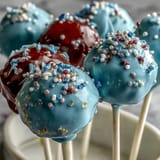 Delicious vanilla cake pops dipped in candy melts, decorated in school colors and finished with edible gold glitter.  