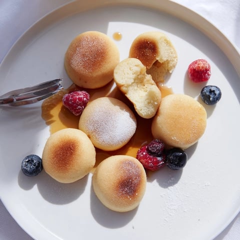 Golden Japanese Mochi Pancake Bites, drizzled with maple syrup, ready for a brunch feast.
