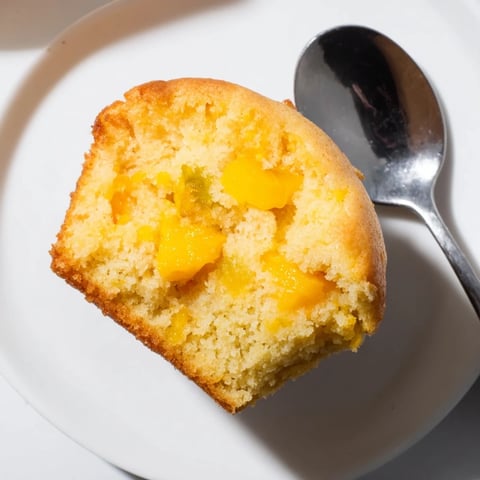 Fluffy Mango Lemon Ricotta Muffins topped with a hint of zesty lemon glaze.  