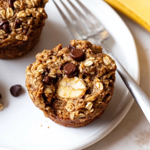 Moist, flavorful Peanut Butter Banana Oat Muffins cooling on a wire rack.  