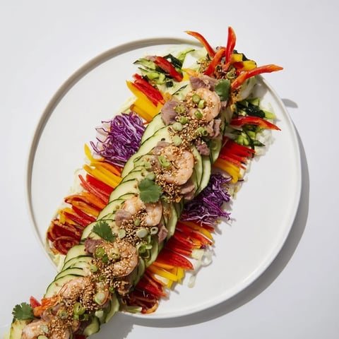 A Mighty Dragon Lunar New Year Board with colorful Asian-inspired bites arranged into a dragon shape.