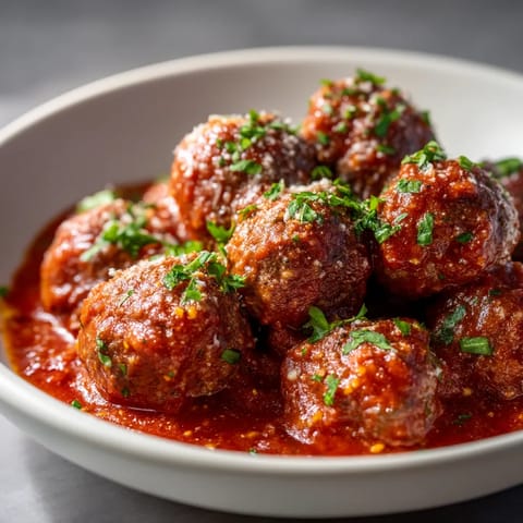 A bowl of meatballs in a tomato sauce.