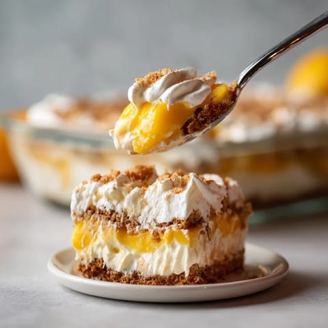 A fork is picking up a piece of cake.