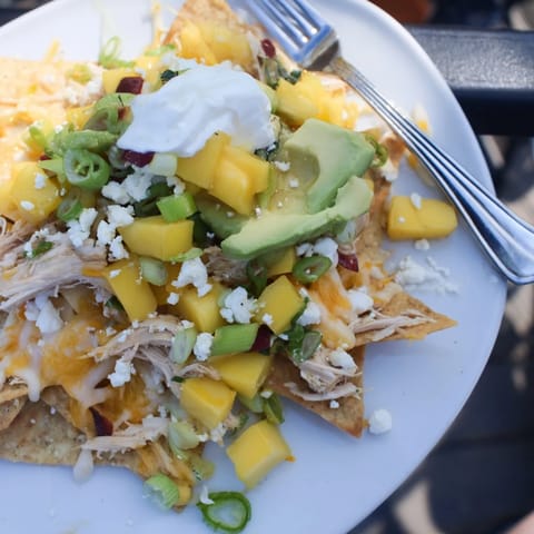 Deliciously layered Mango Pineapple Chicken Nachos bursting with flavors and textures.  