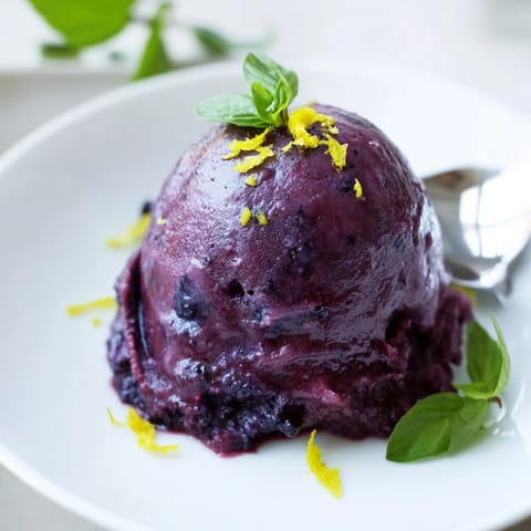 Vibrant sorbet blending sweet blueberries and zesty lemon ready for summer enjoyment.  