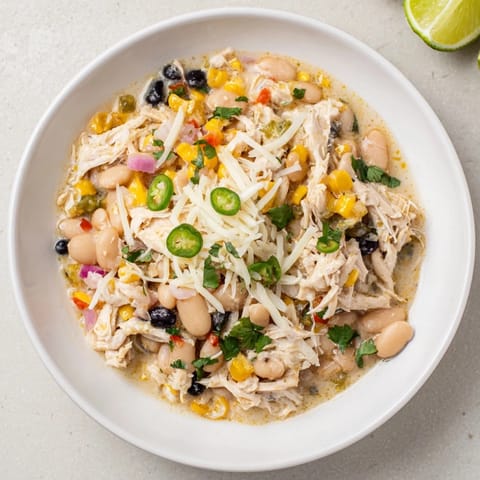 Creamy and flavorful slow cooker white chicken chili with black beans, perfect for a cozy dinner.