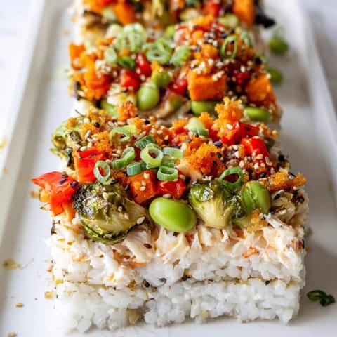 A close-up of the fully baked sushi bake: a delicious combination with seasoned sushi rice and crab.