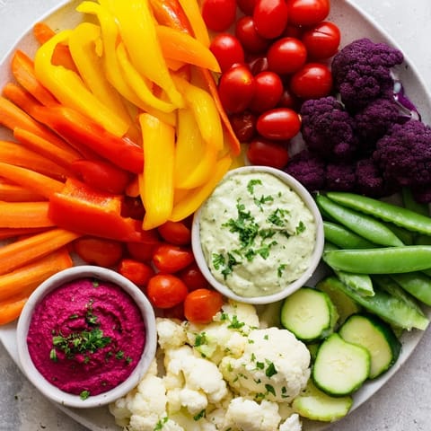Vibrant Rainbow Vegetable Dips: a visually stunning arrangement of colorful vegetables alongside flavorful dips.