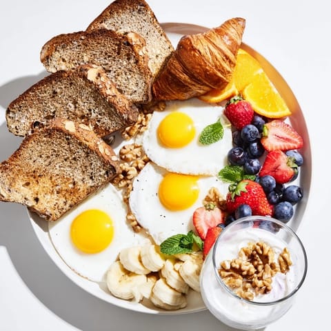A colorful Soleil Matinal Breakfast Platter, featuring yogurt parfaits, and a medley of fresh seasonal fruits.