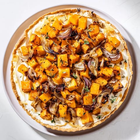 Golden-crusted maple leaf-shaped Feuilles d'Érable Tartes Salées d'Automne, filled with roasted vegetables.