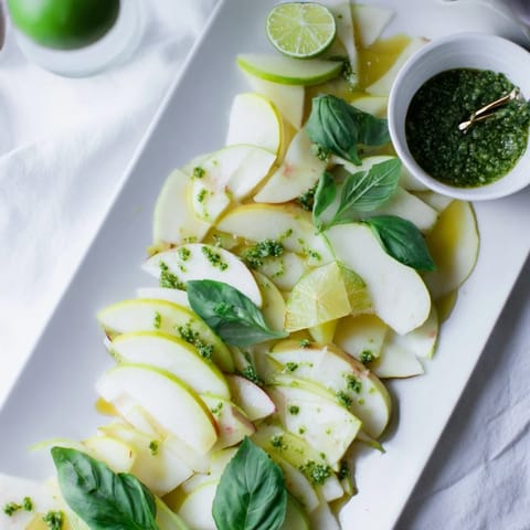 Beautiful array of the Emerald City: Fresh Granny Smith apples, pesto, and green olives awaiting to be enjoyed.