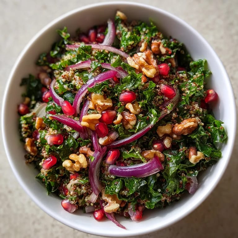 A bowl of salad with onions, nuts and pineapple.