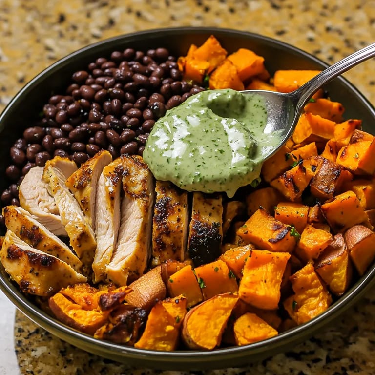 A bowl of food with a spoon in it.