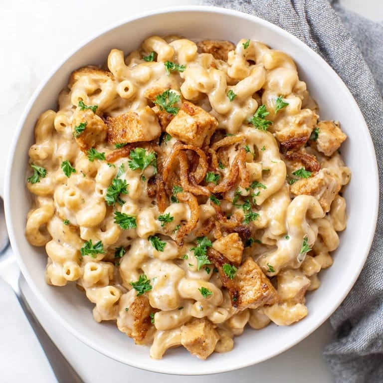 Comforting One-Pot Honey BBQ Chicken Mac and Cheese with sweet and smoky flavors.