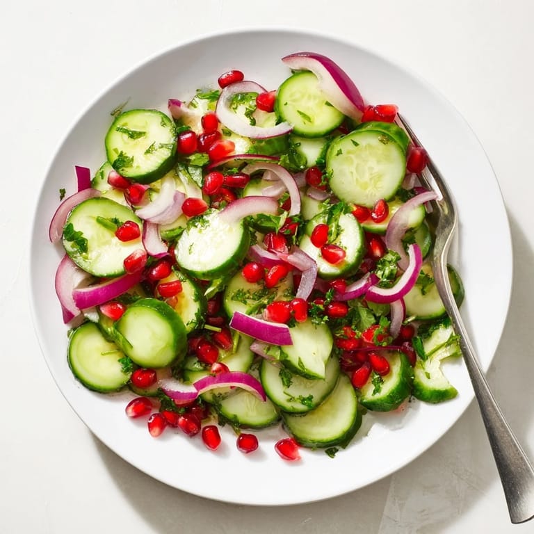 Festive Healthy Cucumber Christmas Salad with crisp cucumber rounds and colorful bell peppers, ideal for the holidays.