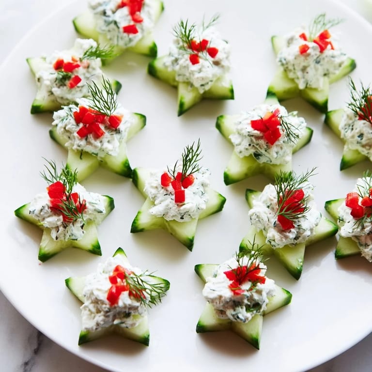Holiday plate of Cucumber and Dill Christmas Stars: bite-sized, refreshing appetizers with fresh dill.