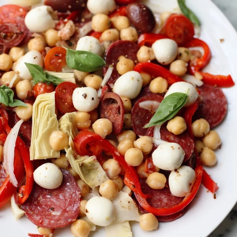 Enjoy this hearty and healthy Antipasto Chickpea Salad, a refreshing gluten-free salad option brimming with flavor.