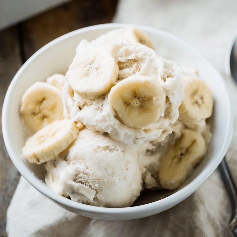 Smooth 2-Ingredient Banana Ice Cream, a vegan-friendly treat perfect for a hot afternoon, with simple ingredients.