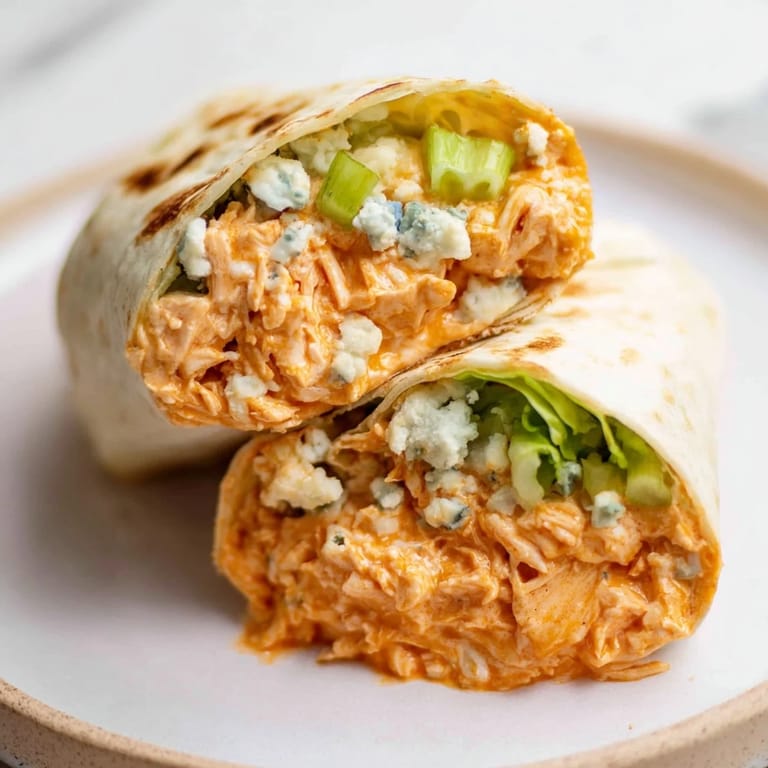 Easy-to-make Buffalo Chicken Dip Wrap, perfect for game day, featuring tender chicken wrapped in a warm tortilla.